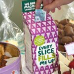 A donation being made at the Great Midshire Bake Off