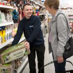 Quality Save employee serving a customer