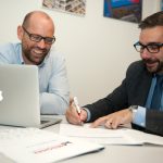 Managing Director of Quality Save Ric Rudkin with Technology Sales at Midshire Stuart Carruthers signing documents