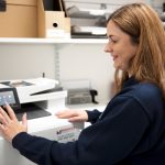 Quality save employee using a HP printer provided by Midshire