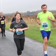 Sarah and Chris Powell running