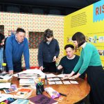 Daniel Bridgeman holding a team meeting